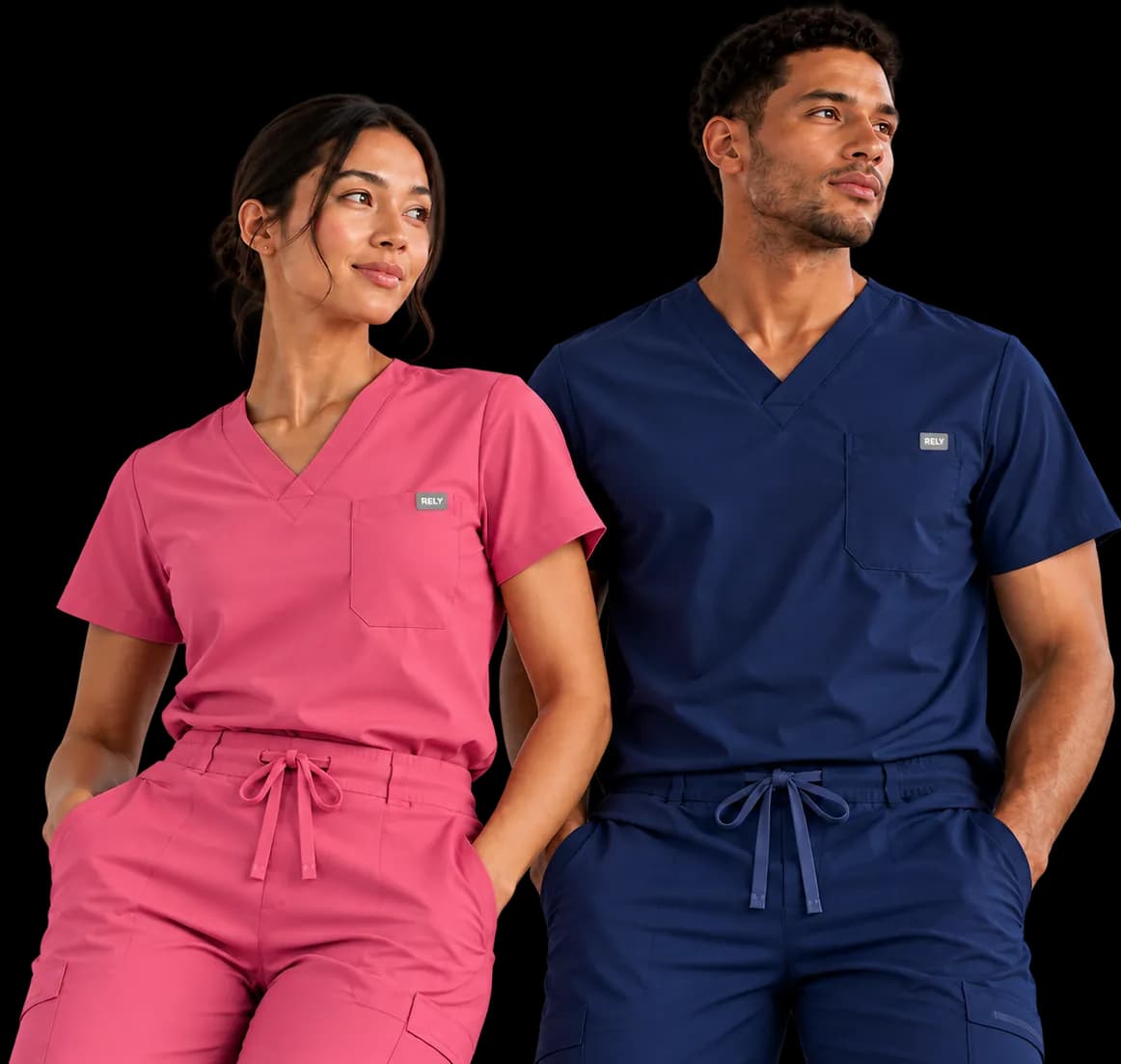 A woman in a Rose Pink RELY scrub set and a man in a Navy RELY scrub set